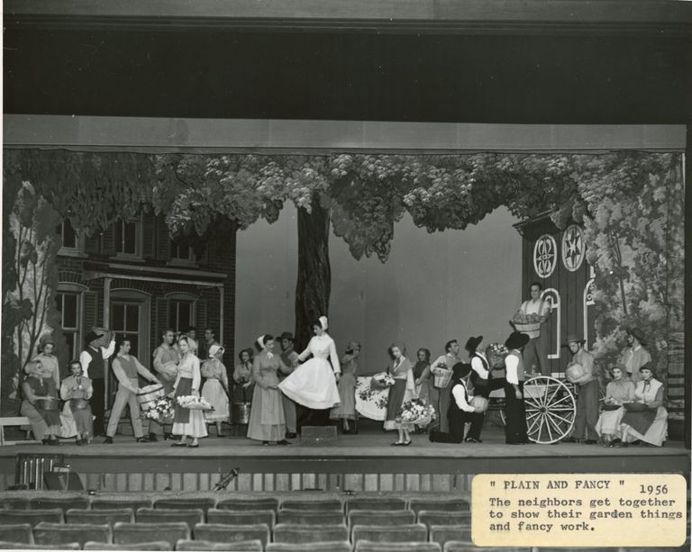          The neighbors get together to show their garden things and fancy work in Plain and Fancy, 1956.
   