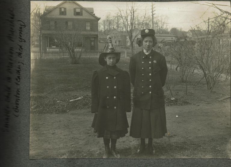          Marshall-Schmidt Album: Marion Marshall in Front of House in Fire Hat picture number 1
   