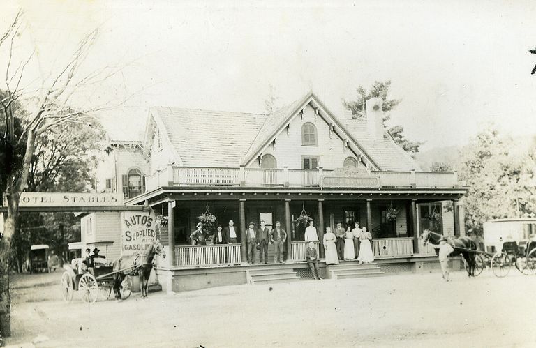          B&W Photograph of the Vauxhall Inn, 321 Millburn Avenue, with People and Horse & Carriages
   