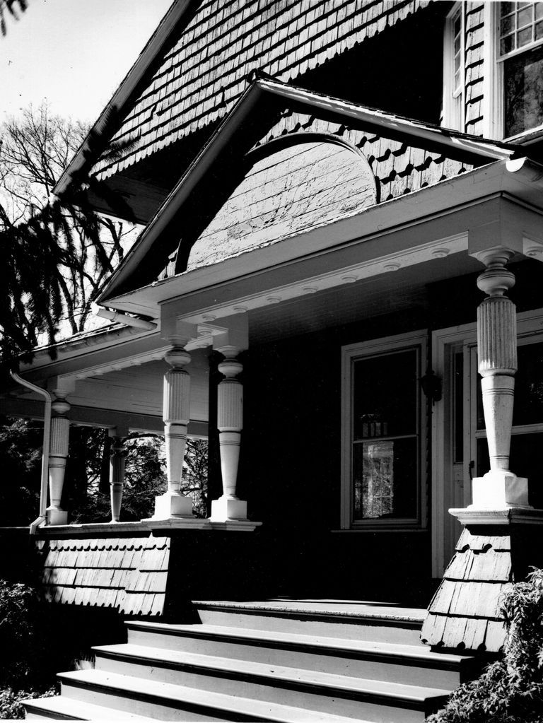          Shingle Style with Queen Anne Style large turned porch posts and heavily carved trim.; 1880-1900
   