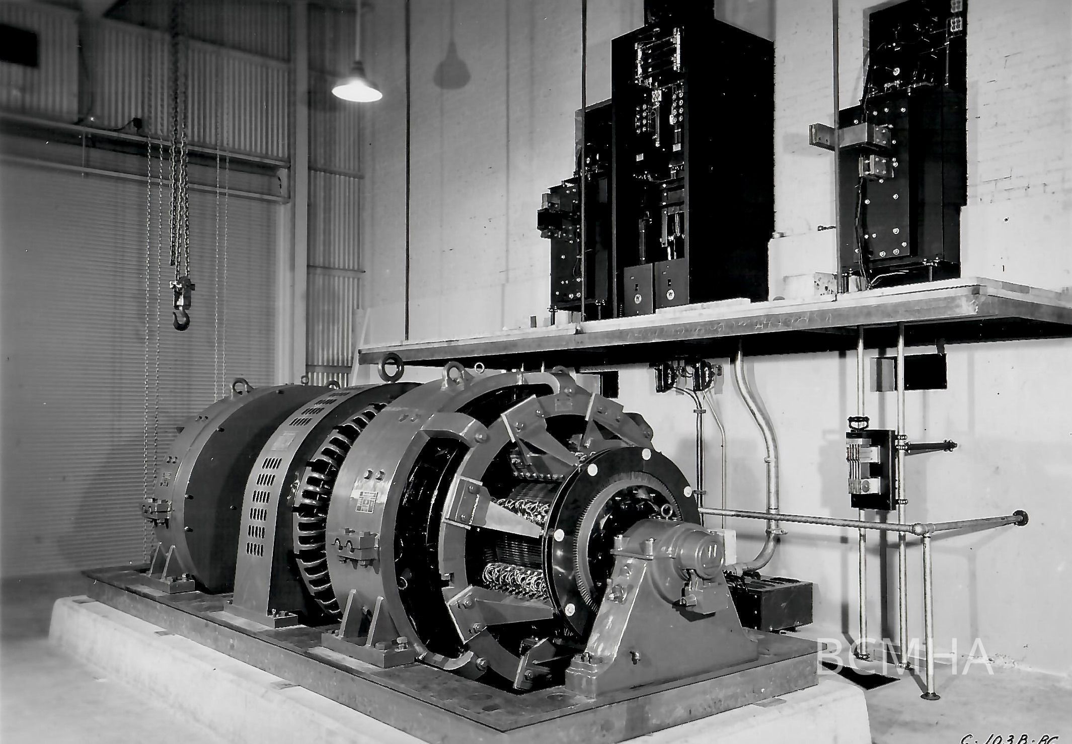 0022:0202: U. S. Bureau of Mines Collection - C-103B-BC Motor Generator Set for Supplying DC Power: This 700-horsepower generator set is capable of supplying up to 10,000 amperes with controlled voltage from 6 to 45 volts. It was designed expressly for experimental electrolytic work and is unusually versatile. The generator was used to supply power for pilot-plant production of electrolytic manganese over a four-year period. It is in stand-by condition for future problems. Smaller generators and rectifiers supply adequate power for present projects.