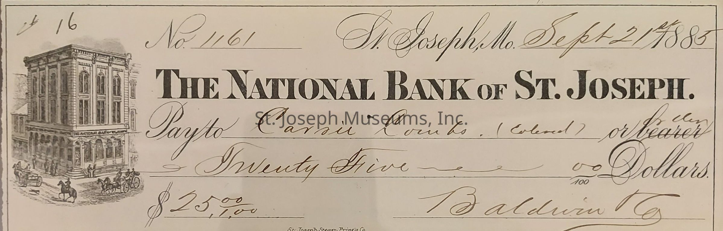 The image is an old bank check from The National Bank of St. Joseph, dated September 27, 1885, and numbered 1161. The check is made out to Carair Combs, or bearer, for the amount of twenty-five dollars, as indicated by both the numerals "$25.00" and spelled-out words "Twenty Five Dollars." The check includes ornate, cursive handwriting for the details and a picture of the bank building on the left side, depicting a busy street scene with people and horse-drawn carriages. The signature at the bottom is by someone named Baldwin. This piece of financial history reflects the style and transactions of the late 19th century.