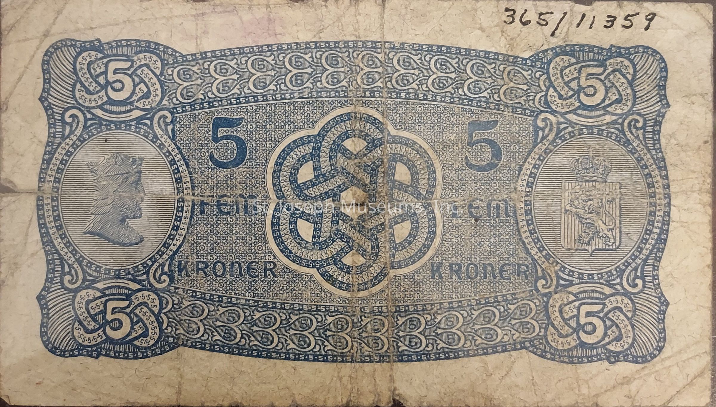 The image depicts an old and worn banknote with a denomination of 5 kroner, showcasing intricate blue designs on a faded white background. In the center, there is an elaborate interwoven pattern surrounded by the numeral "5" and the word "kroner." On the left side of the note, there is a circular portrait of a figure in profile, while the right side features a heraldic emblem with a crown and a lion. The edges of the note are adorned with decorative borders, also incorporating the numeral "5" repeatedly. The note has visible creases and dirt, indicating its age and usage. In the top right corner, handwritten numbers are visible, possibly serving as a serial identification for the note. The overall design reflects historical currency aesthetics, combining security features with artistic elements to create a visually compelling piece of monetary history.