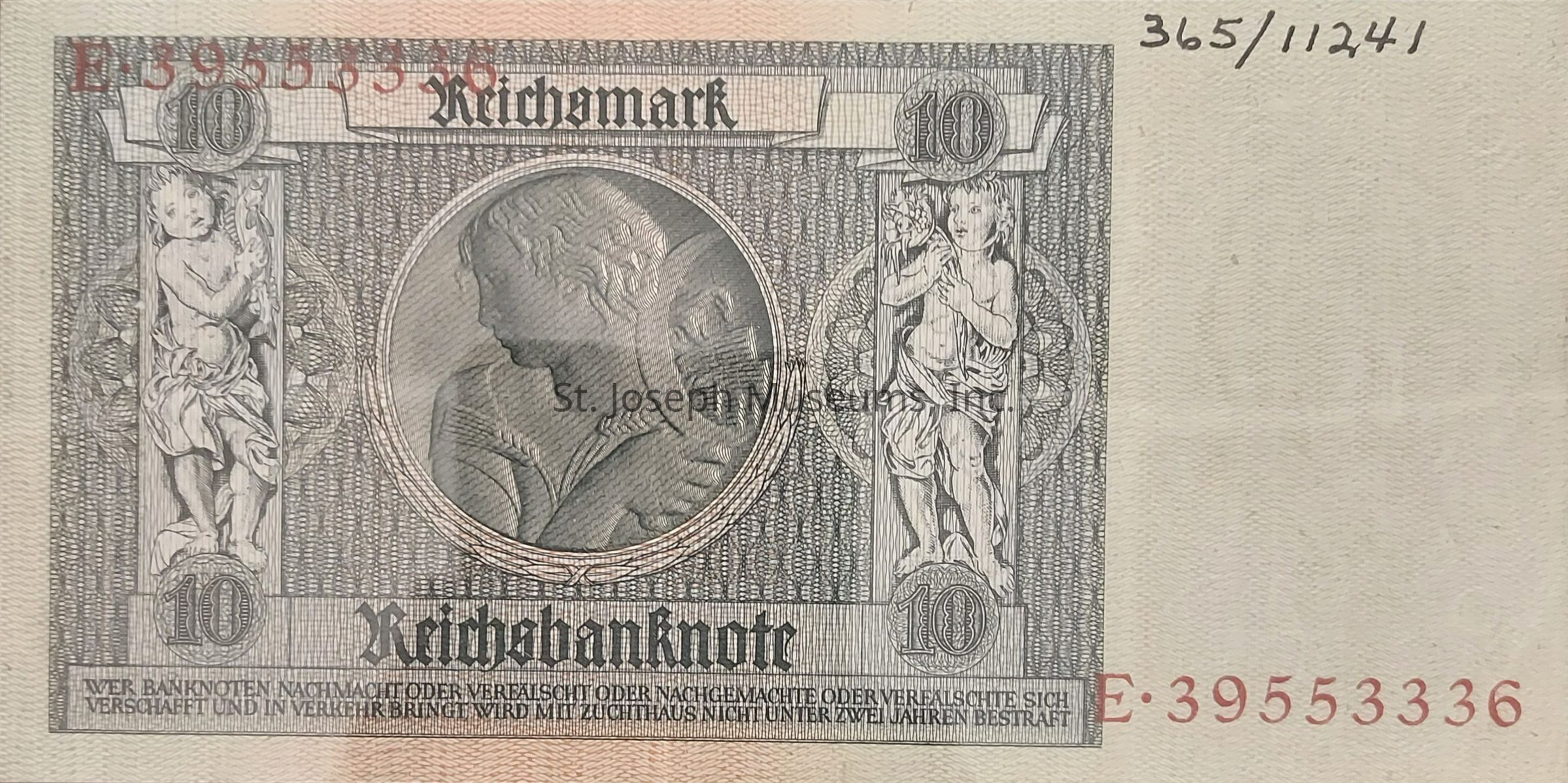 The image depicts an old 10 Reichsmark banknote characterized by intricate design elements and historical artwork. Prominently displayed at the top center is the denomination "10" enclosed in ornate circles on both sides. At the center is a detailed portrait of a woman in profile, bordered by intricate patterns and framed within a circular medallion. Surrounding this central image are two cherubic figures, each standing beside the centerpiece, adorned with flowing garments and holding floral arrangements. Below these elements, "Reichsbanknote" is printed in bold, gothic style lettering, emphasizing the currency's official status. The serial number E-39553336 appears in red along the lower right edge. The overall design combines both artistic flair and formal elements typical of early 20th-century banknotes, reflecting the historical context and aesthetic of the time.
