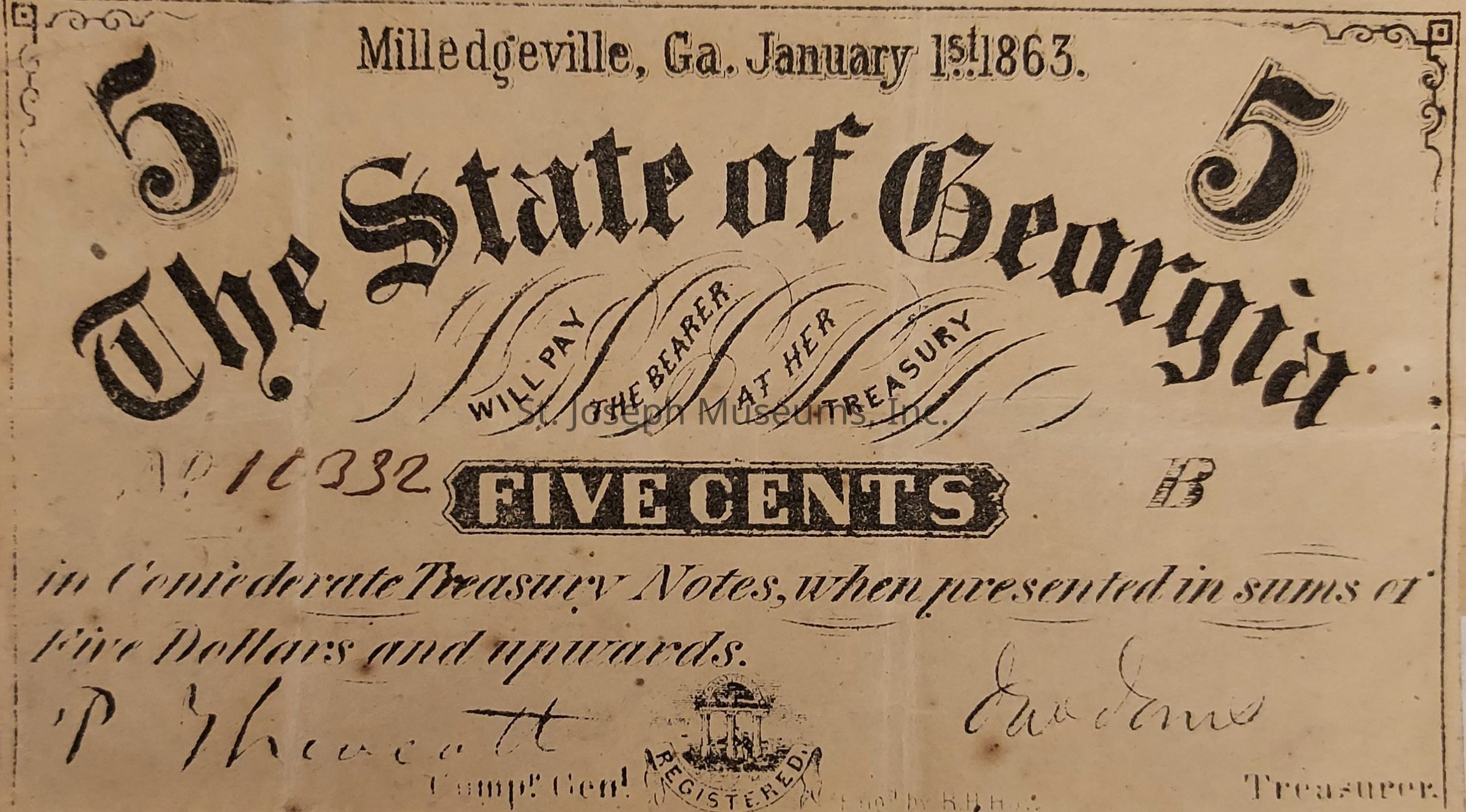 The image displays an old five-cent paper currency note from the State of Georgia, dated January 1st, 1863, issued in Milledgeville, Georgia. The note features ornate text and design elements, with the denomination prominently displayed in large numbers at the corners and in the center, marked as "FIVE CENTS." The text indicates that the note "will pay the bearer" an amount "at her treasury." It is payable in Confederate Treasury Notes when presented in sums of five dollars and upwards. The note includes signatures and an embossed stamp labeled "REGISTERED." Additionally, decorative flourishes surround the text, enhancing its historical appearance.