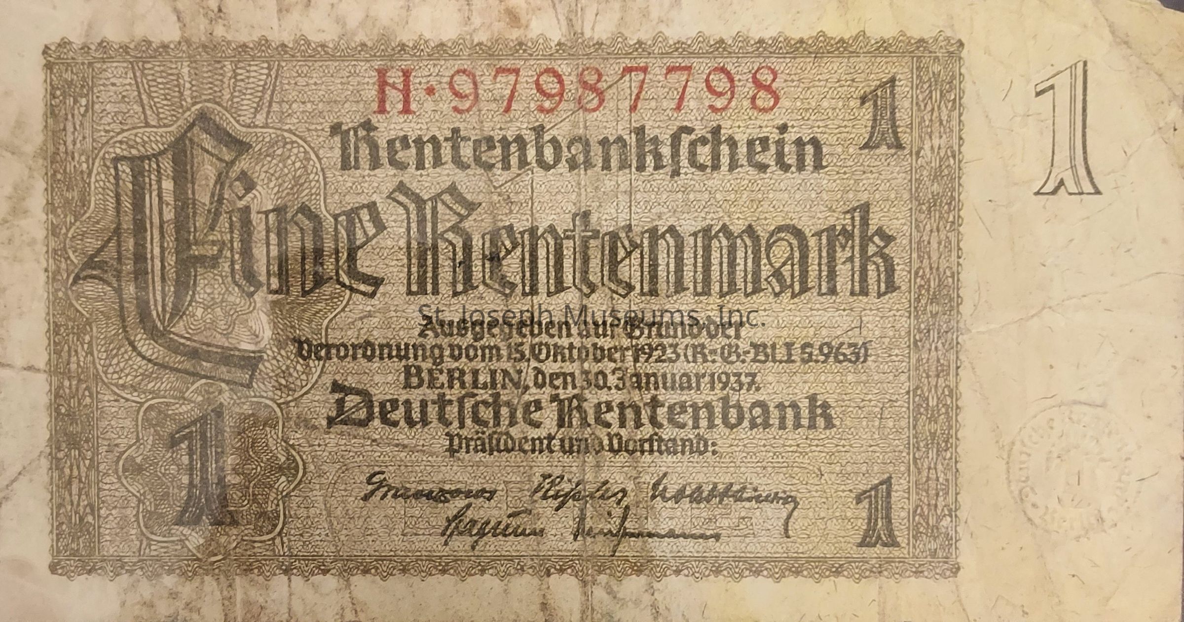 The image shows a vintage German banknote valued at one Rentenmark, issued by the Deutsche Rentenbank, characterized by ornate design elements and Gothic script that reads "Rentenbankschein" and "Eine Rentenmark," accompanied by a red serial number "H-97987798" at the top, and including the issue date of January 30, 1937, in Berlin, alongside signatures and official stamps, indicative of its circulation during the post-World War I economic period aimed at stabilizing the currency following hyperinflation, with decorative patterns framing the note and the denomination "1" prominently displayed in each corner.