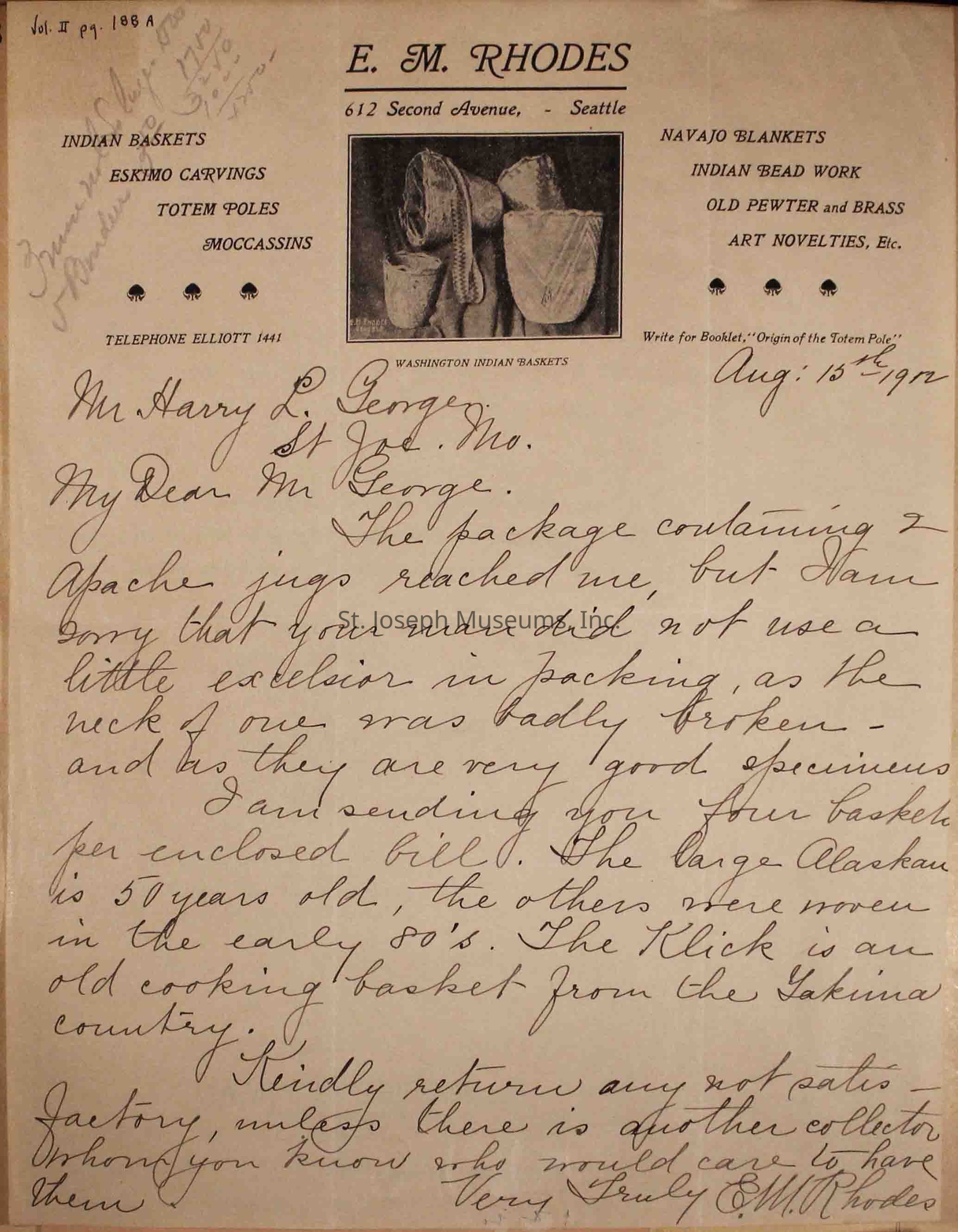 The image depicts a vintage letter with a letterhead reading "E. M. RHODES" with an address at 612 Second Avenue, Seattle, and lists items like Indian baskets, Eskimo carvings, and Navajo blankets. There's a handwritten letter dated August 15, 1902, addressed to Mr. Harry L. George in St. Joseph, Missouri. The letter discusses a package containing Apache jugs, mentioning damage due to poor packing. It also notes the dispatch of four baskets.