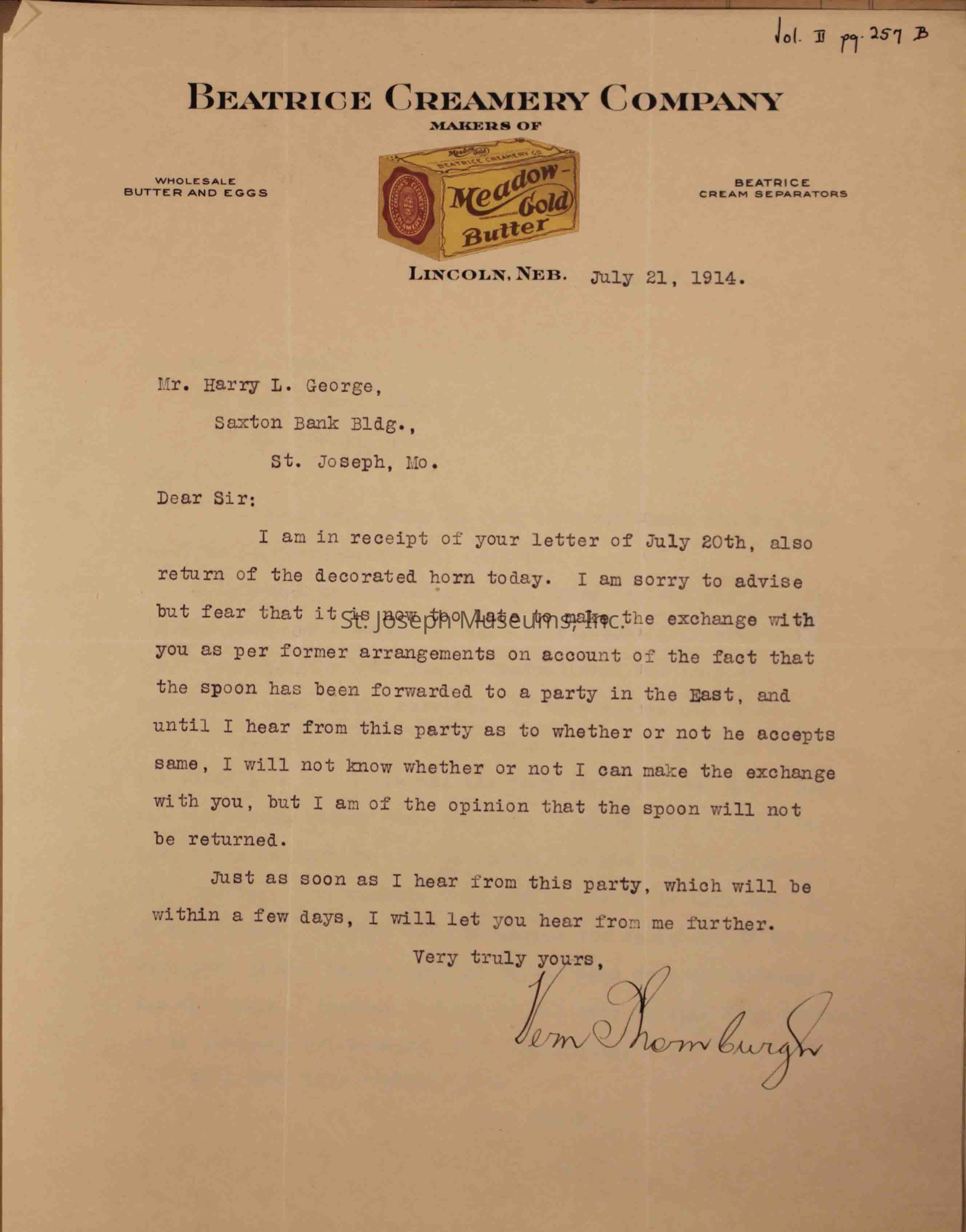 The image is a letter from Beatrice Creamery Company, dated July 21, 1914, to Mr. Harry L. George, stating the receipt of his letter and a decorated horn. The letter expresses regret about the delay in making an exchange due to prior arrangements, as the spoon has already been sent to another party.