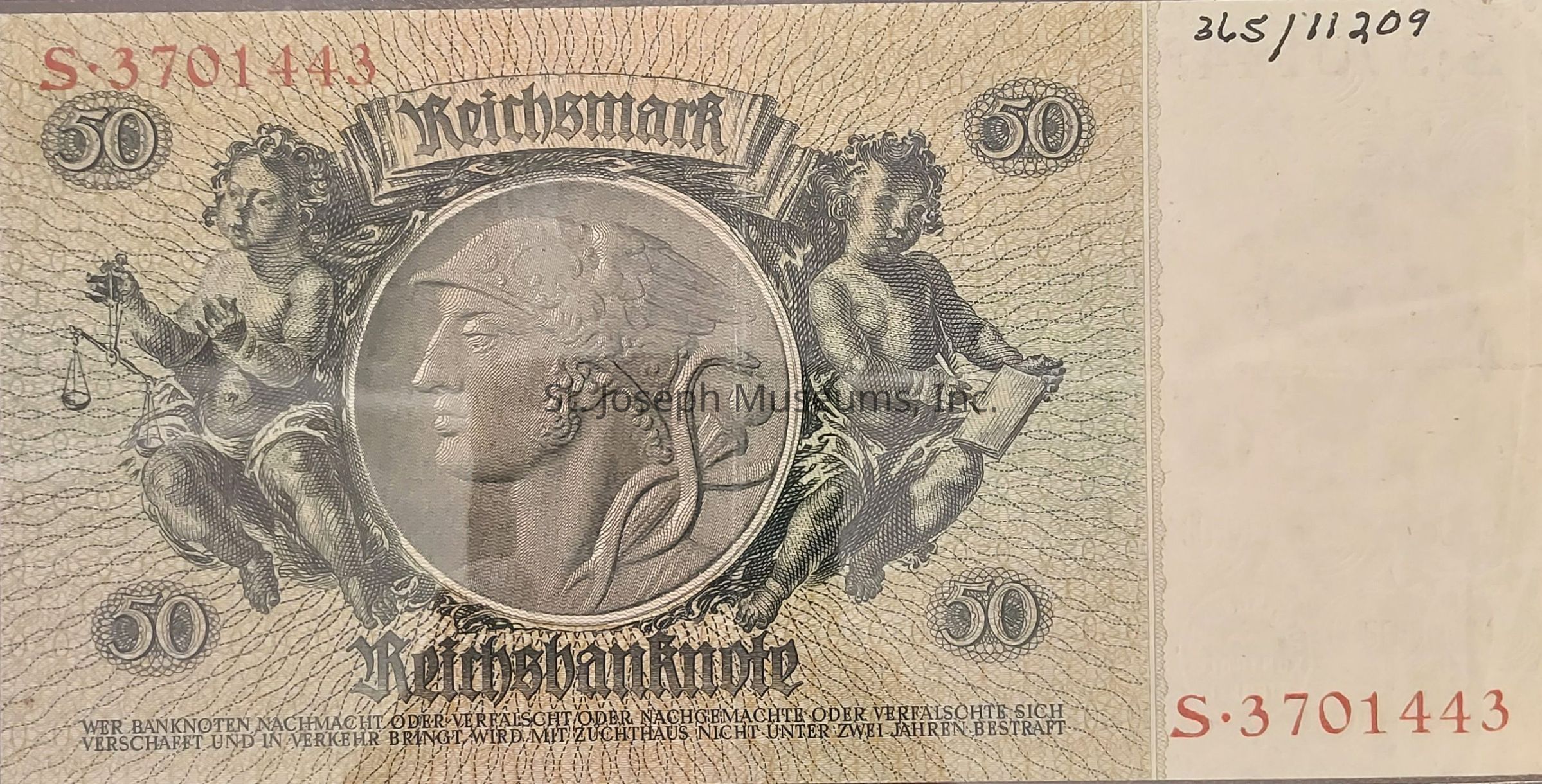 The image displays a 50 Reichsmark banknote featuring detailed engravings, including a central profile of a classical figure in a circular frame. On either side of the portrait, there are two cherubic figures; the one on the left holds scales, symbolizing justice, while the one on the right holds a quill and paper, indicating scholarly pursuits or record-keeping. The denomination "50" is prominently displayed in each corner of the note, and the word "Reichsbanknote" is inscribed across the bottom, signifying the issuing authority. The serial number "S.3701443" is printed in red on the left and right margins, possibly as a control or batch identifier. The background consists of intricate line patterns, adding to the note's sophistication and security features. Text at the bottom warns against forgery, indicating strict penalties for counterfeiters.