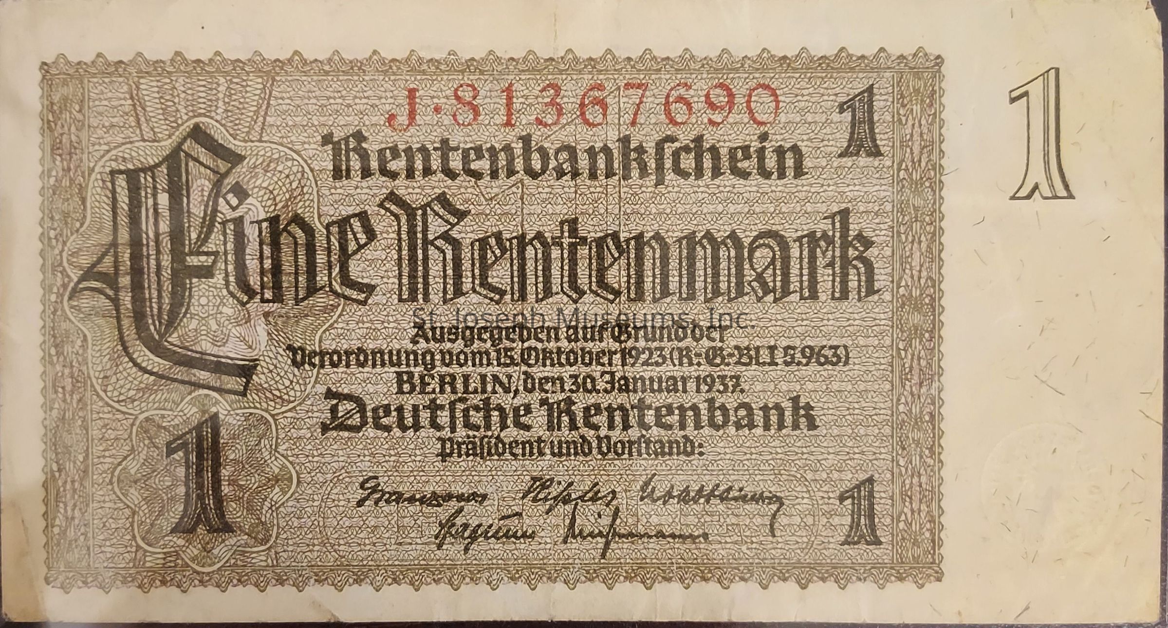 The image is of a historical German banknote, known as a "Rentenbanknote," valued at one Rentenmark. The central text on the note is written in a decorative, old-style German script, prominently displaying the value "Eine Rentenmark." The serial number, "J.81367690," is printed in red ink at the top. There are ornate patterns around the text, contributing to an intricate design. The note indicates it was issued by the Deutsche Rentenbank, with Berlin as the location and the date of issuance as January 30, 1937. On the lower portion, signatures are visible, likely those of bank officials. Using dark and light brown hues, the overall appearance reflects the artistic and functional style typical of early 20th-century currency design.