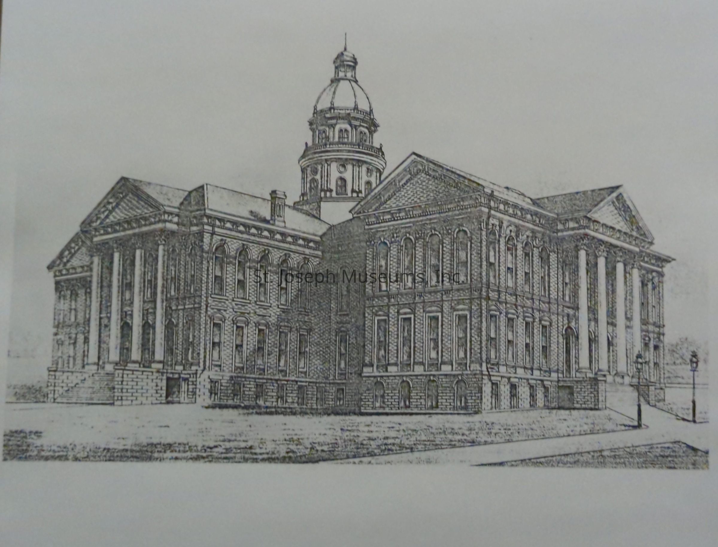 Drawing depicts the Buchanan County Courthouse, showcasing its grand architectural style with a prominent dome and classical columns. The detailed pencil sketch captures the intricate design elements, highlighting the building's historical significance and imposing presence. The courthouse stands majestically between 4th and 5th streets.