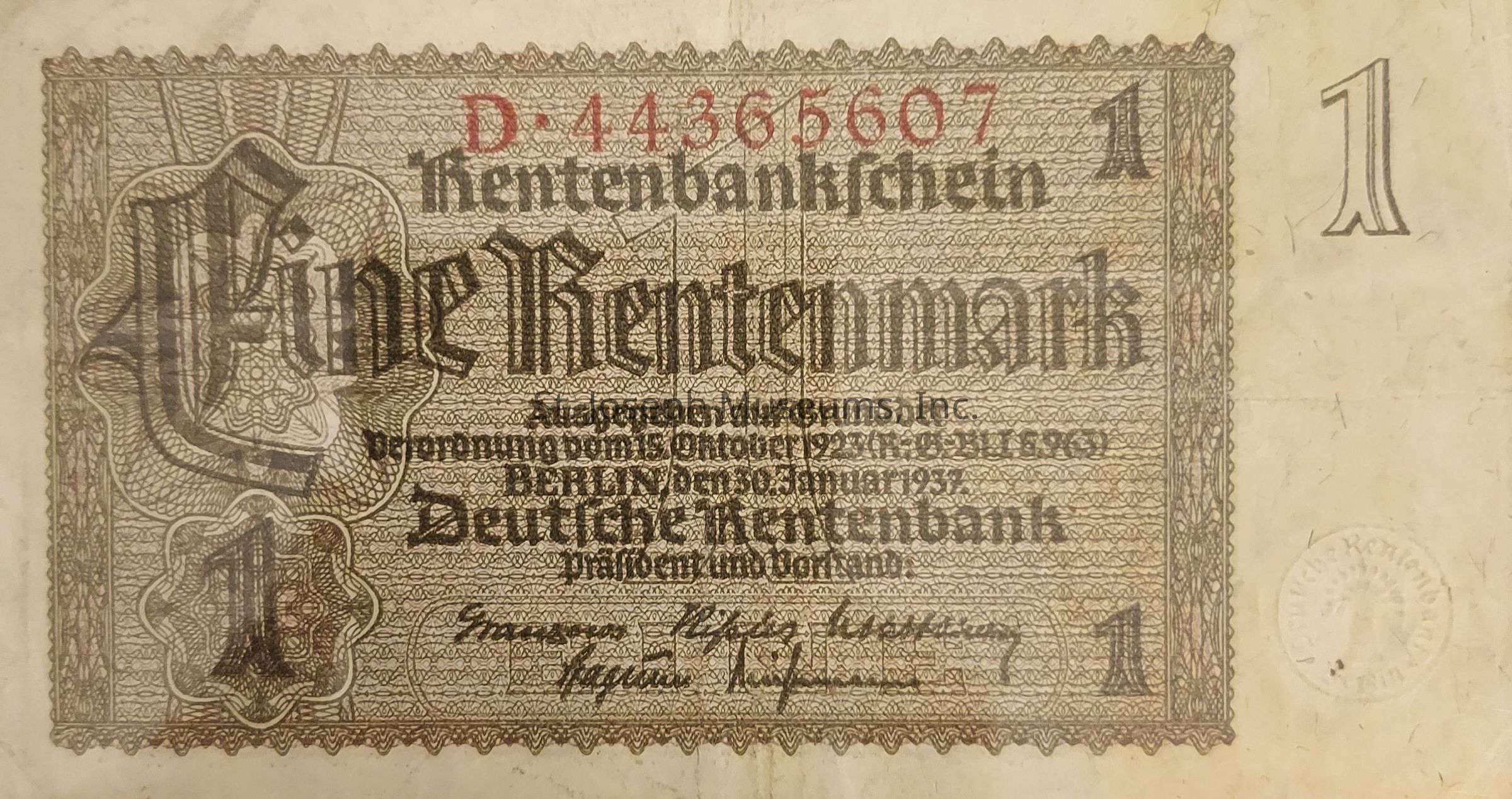 The image depicts a historic banknote from the Weimar Republic era in Germany, specifically a 1 Rentenmark note with detailed engravings and Gothic script. The top of the note features a red serial number, "D-44365607", prominent against the intricately designed background. The text "Eine Rentenmark" is prominently displayed in the center, signifying the denomination. Below it, finer print describes the conditions or authority under which the note was issued ("Berlin den 30 Januar 1937"), referencing the Deutsche Rentenbank. The border is adorned with geometric patterns, while the number "1" is repeated at the corners to indicate the denomination. On the lower section are signatures, likely from bank officials, and a subtle embossed seal adds authenticity. The overall design reflects a period of economic stabilization in Germany following hyperinflation, characterized by detailed craftsmanship and official state markings, providing historical context and value.