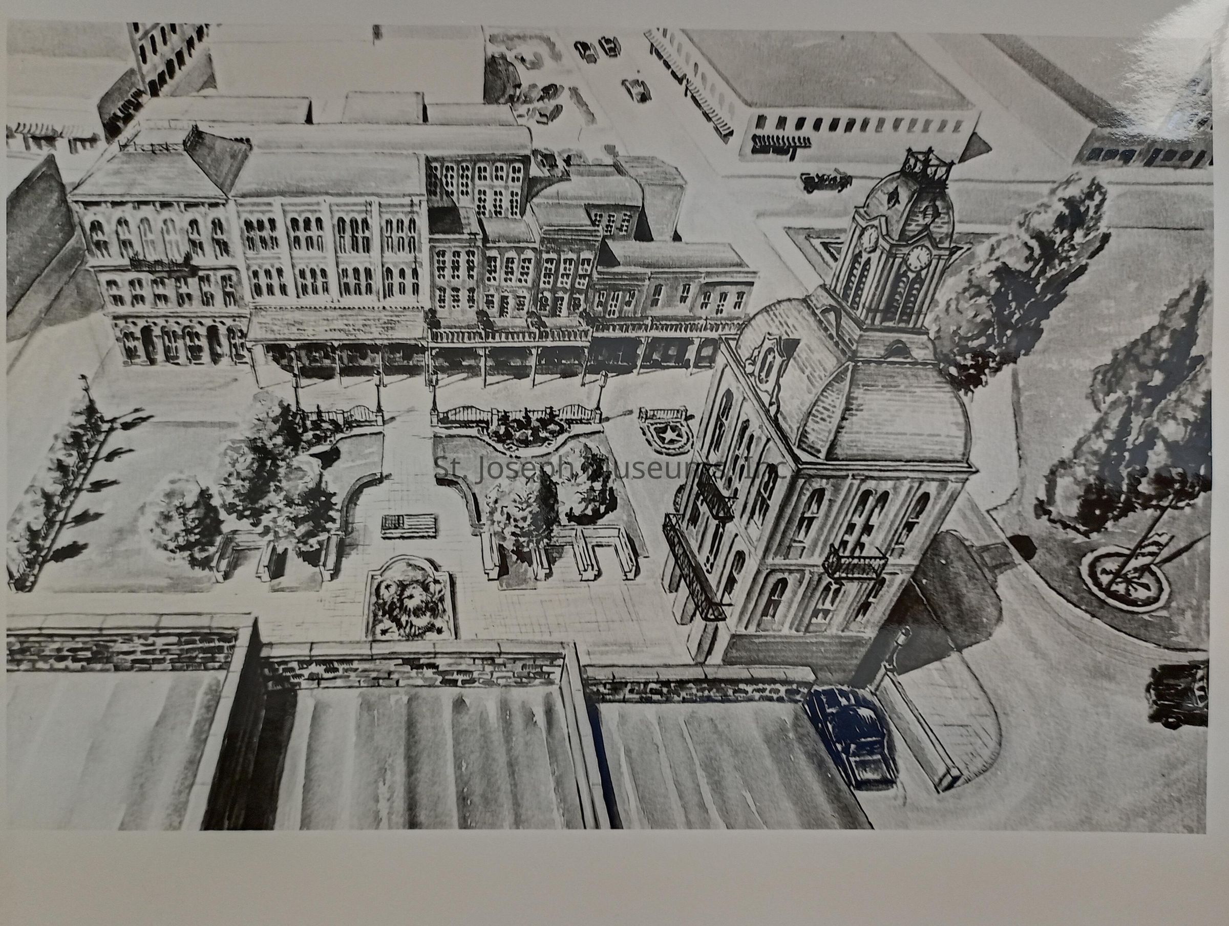 Artist's drawing depicting a restoration project of a historical city area located between Felix and Francis Streets, featuring the charming Market Square and City Hall of St. Joseph, Missouri. The illustration showcases intricate architectural details of the buildings surrounding a tree-lined square with pathways and benches, highlighting the plan to revitalize the space. The towering City Hall, with its ornate facade and clock tower, stands prominently.