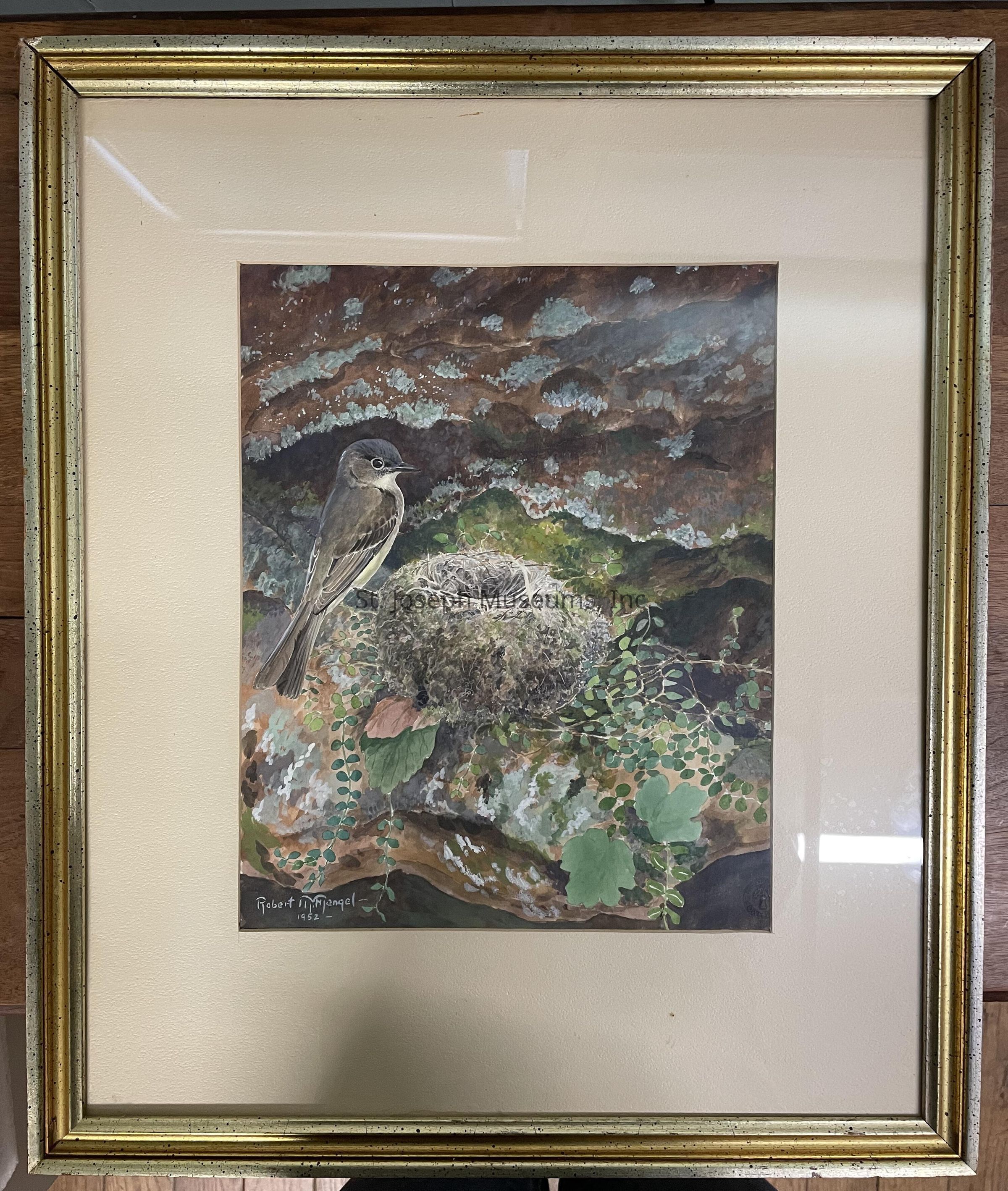 The image showcases a framed painting depicting a small bird, possibly a flycatcher, perched beside a nest nestled within a rugged, textured landscape. The bird is rendered in delicate detail with a focus on its soft feather pattern, while the nest, intricately woven and covered in moss, rests amidst greenery and rocks adorned with patches of vivid green leaves and earthy tones. The painting’s dynamic background suggests an intricate play of light and shadow across the natural elements, enhancing the scene’s depth and realism. Displayed in a simple, elegant gold frame, the artwork carries the signature of the artist and the year "1952" in the bottom left corner, suggesting both the period in which it was created and its classic aesthetic. Overall, the composition conveys a serene, naturalistic atmosphere, capturing a quiet moment within the wild, likely invoking a sense of wonder and appreciation for nature's intricate beauty and the artist's skill in capturing such a vivid, lifelike portrayal.