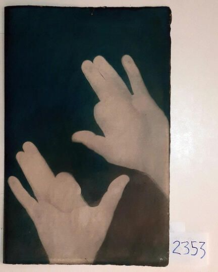 Handmade Dog Cyanotype No. 15 of 32: Norman Durkee, a Seattle composer, was a friend of mine and he sent me a tape of works made on his new Buchla synthesizer. One was titled, "Handmade Dog," a silly, rambling ditty with his synthesized "Woof woof" interspersed. My thought was to collaborate with Norman with my own handmade dogs. I had been doing such hand-shadow prints for some time. The technique, cyanotype, is sometimes called "sun printmaking" because sunlight is ideal, especially in months when the sun is high and rich in UV. The method requires coating paper with chemicals, letting it dry in a dark place, and then - in the sun as I did in this series - laying the paper out flat and putting like one's hand on it. Where the sun strikes the chemical, a reaction occurs and after some seconds or a minute, the paper is shielded until it can be washed. In cold, running water, the unexposed chemicals dissolve and wash away. Where the sun struck, the chemicals became insoluble and turn blue. Invented at the time many photo processes were (the mid-19th Century), it never achieved commercial value except in making blueprints and fine art photographs. To make the series of 32 prints I made a cyanotype or two a day in the summer of 1982, climbing to the rooftop hatch to the top of the Journal of Commerce Building in Seattle, which was home to the Triangle Studios for me from 1977-1983. See my memoir, "Dumb Hope: My curious life - 1981-1990."