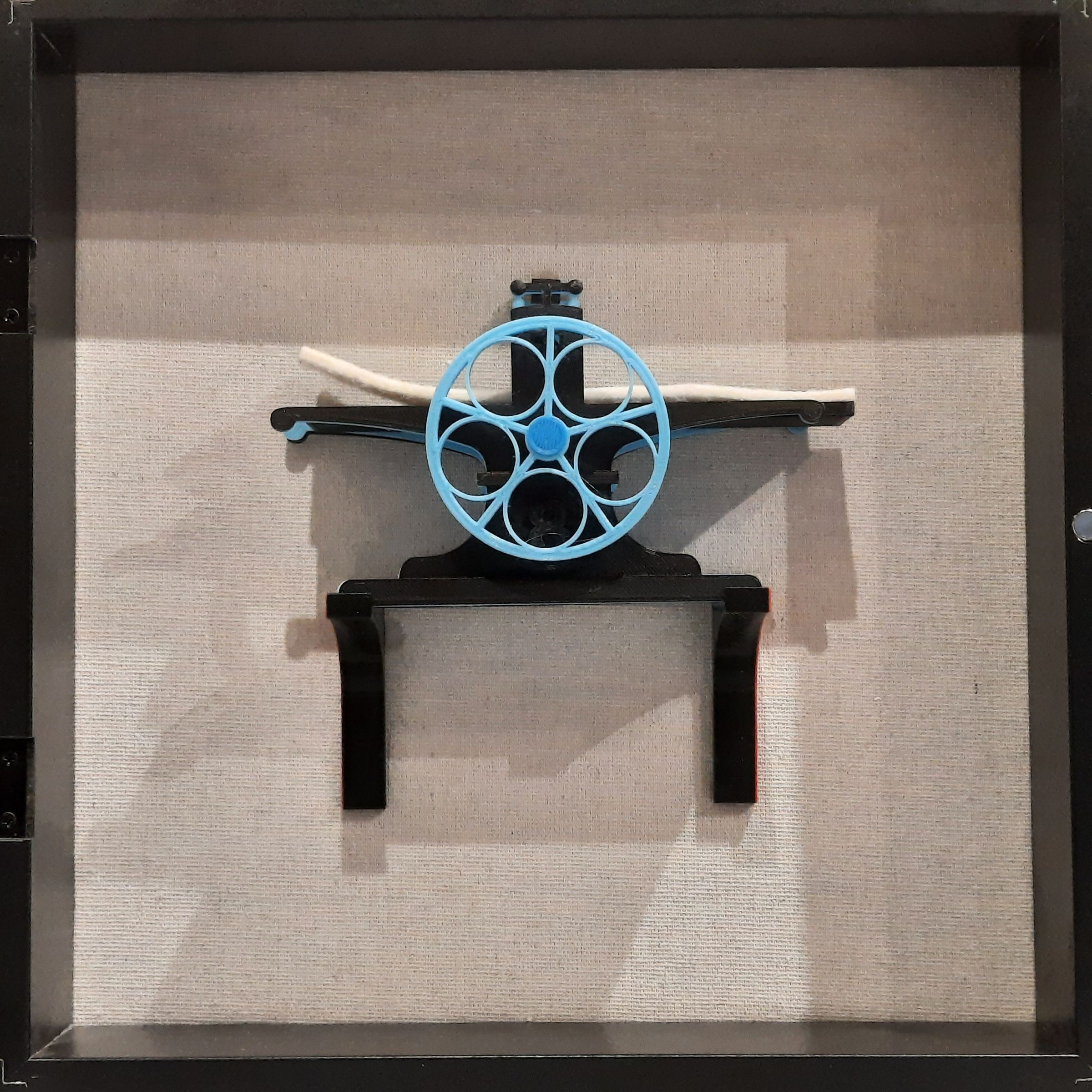 This is a WeePLA Press, designed and printed by Bill Ritchie, Seattle, in 2024. He named it “Wee” because it is tiny, “PLA” because it is made of polylactic acid (PLA) plastic. It is modeled on the Halfwood presses Bill designed; but it's not a working press. It was inspired by Martin Schneider’s openpressproject.com. Bill's is a collector’s item, a toy conceived for kids to print and sell in kidpreneur fairs and promote STREAM-core Ed and Kids Printmaking Spaces.