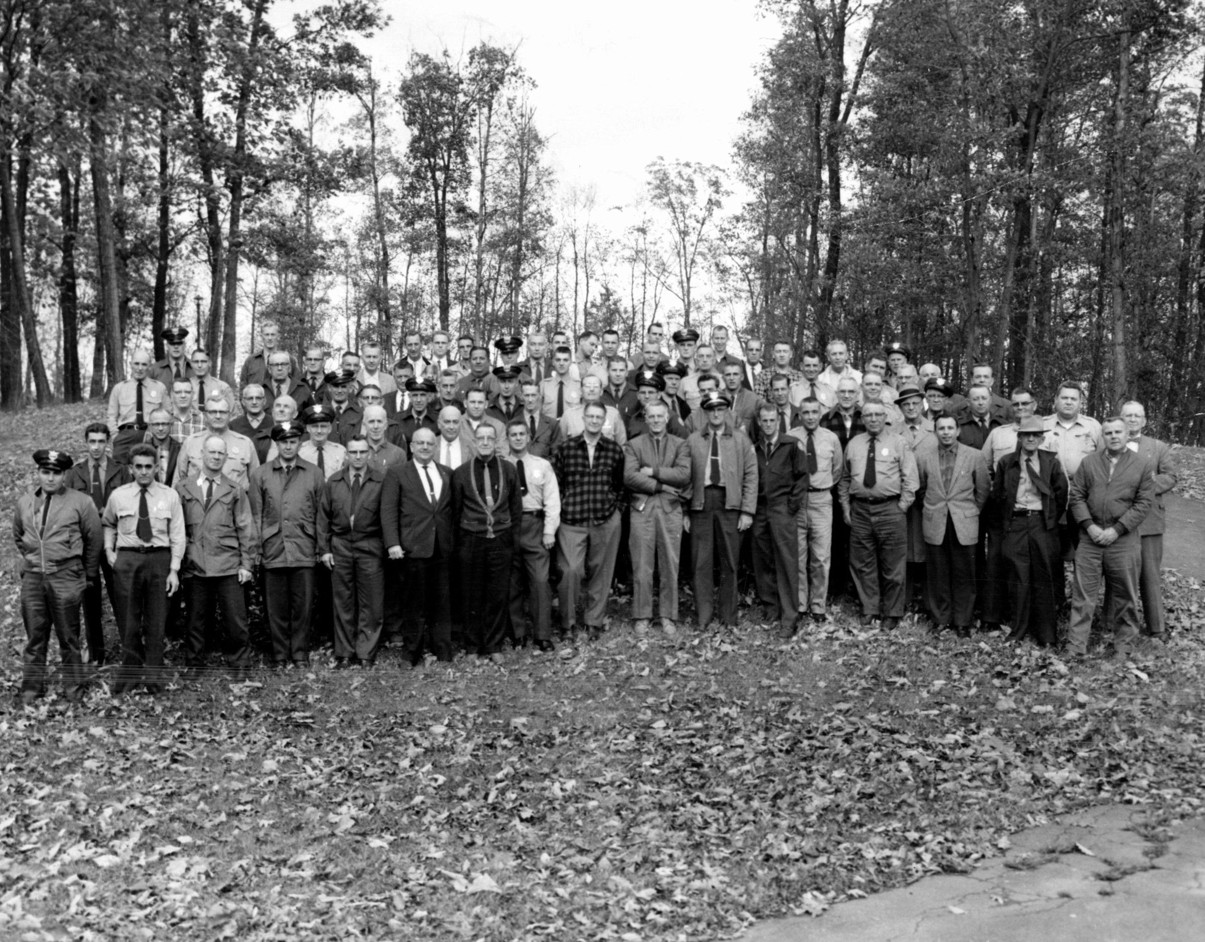 Lake Hope State Park - Tenth Annual Park Managers Training School Group Photo, 1960: Park managers from throughout the state of Ohio gather at the Tenth Annual Park Managers Training School. This program began in 1951 at Lake Hope State Park and was intended to promote efficiency and consistency in park management practices. This photograph comes from the conference held at Lake Hope State Park between October 30 and November 2 of 1960.