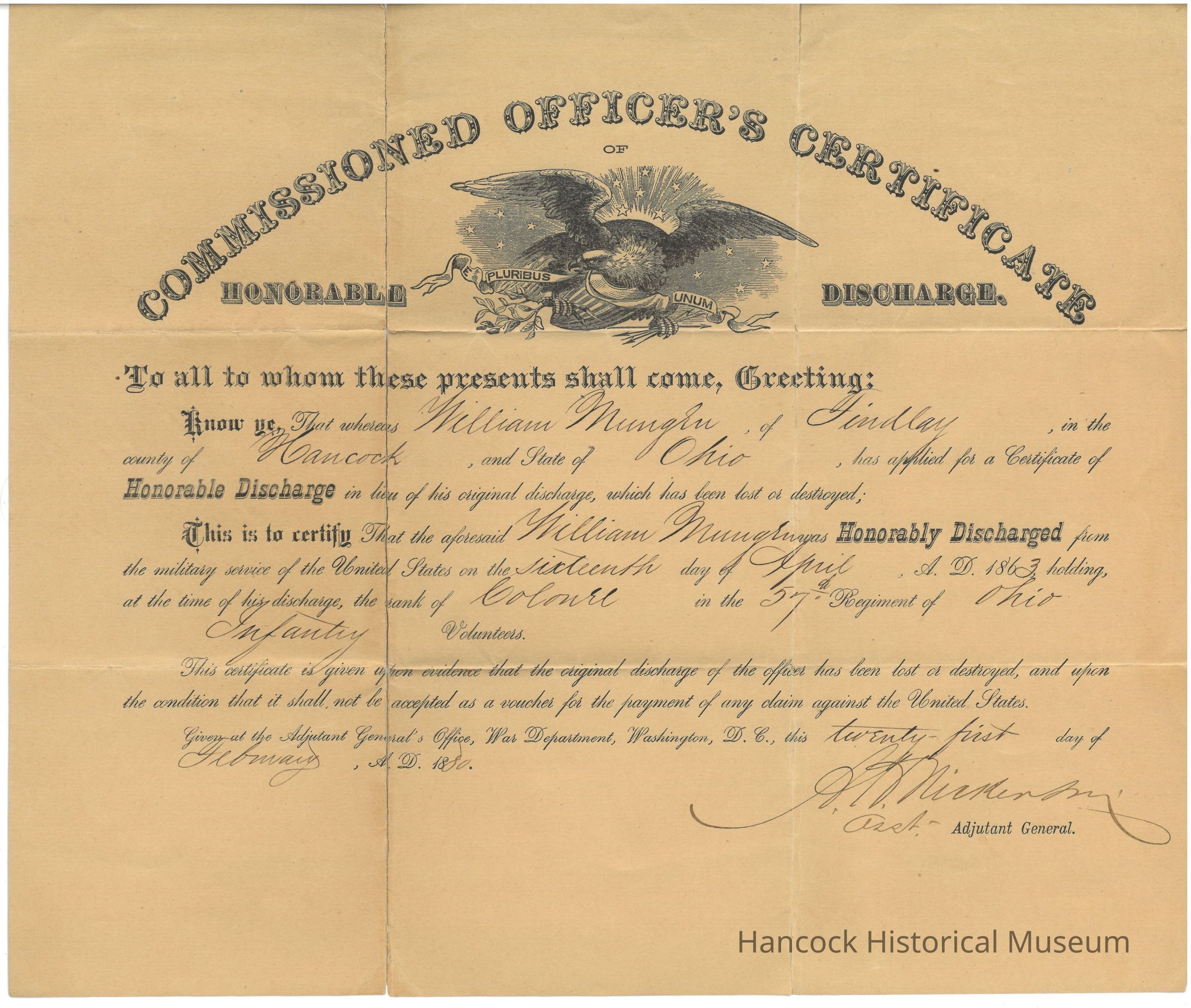 The image shows a vintage, official document titled "Commissioned Officer's Certificate of Honorable Discharge." It features an emblem of an eagle with the motto "E Pluribus Unum" above its head. The document is printed in a decorative font and is addressed to individuals concerned, indicating that William Mungen of Findlay, Hancock County, Ohio, has applied for and is granted a certificate of honorable discharge from the United States military service. He held the rank of Colonel in the 57th Regiment of Ohio Infantry Volunteers. The discharge is dated April 16, 1863. The document states that this certificate serves as evidence of the original discharge being lost or destroyed and is not valid as a financial voucher. It is issued by the Adjutant General's Office, War Department, Washington, D.C., signed by the Assistant Adjutant General on April 21, 1864.