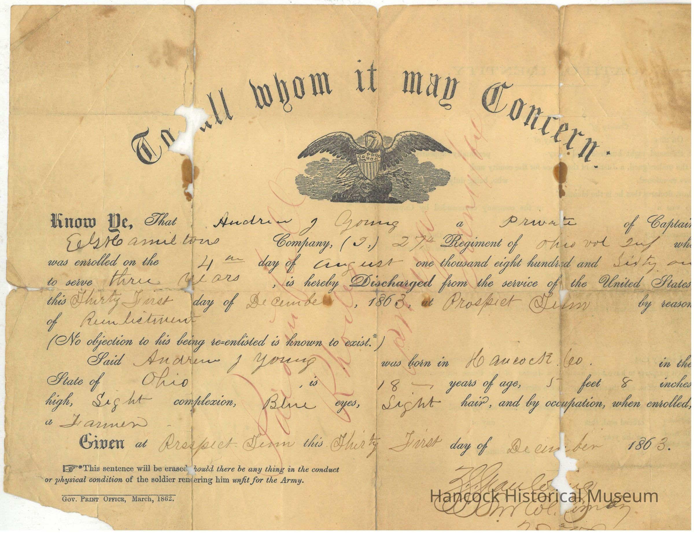 The image shows an aged military discharge document with noticeable wear, including folds, tears, and stains, indicative of its historical significance. The document contains handwritten and printed text on yellowed paper, featuring the phrase “To all whom it may concern” prominently in elegant script at the top. An illustration of an eagle—a symbol often used in official documents—is centrally positioned, adding a formal touch to the page. The text specifies details of an individual's military enrollment and discharge, referencing service in a particular regiment. Various handwritten notes, including dates and locations, are scattered throughout, adding personal and historical context to the document. The paper appears fragile, suggestive of its age and handling over time.