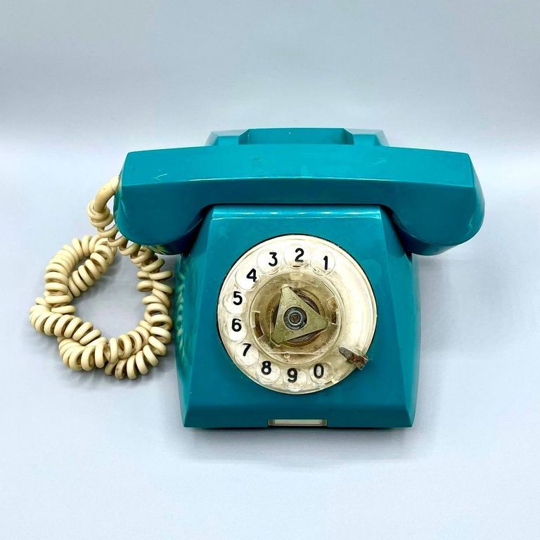 Rotary-dial desk telephone, teal plastic