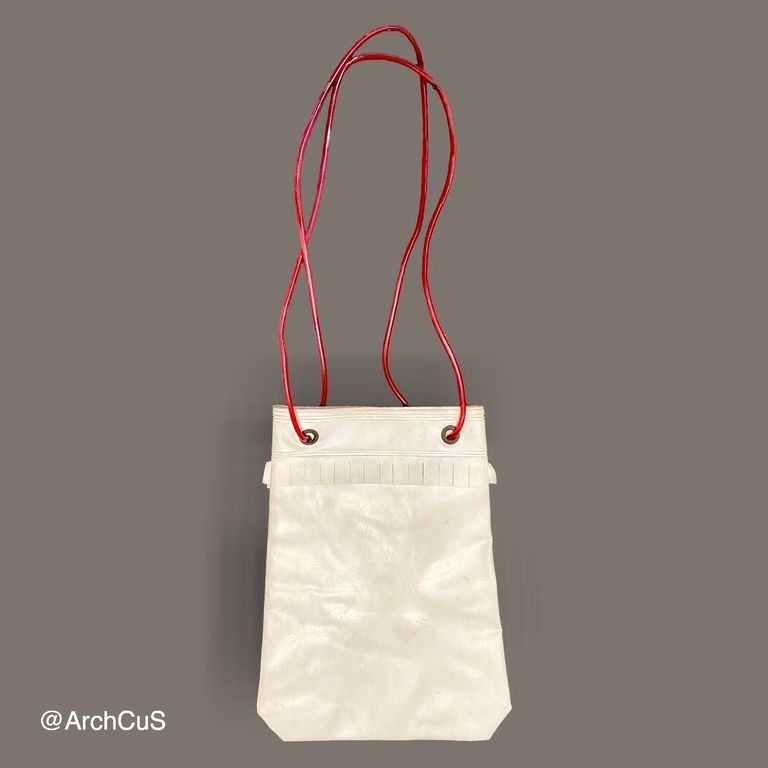 PVC shoulder bag with red cord handles