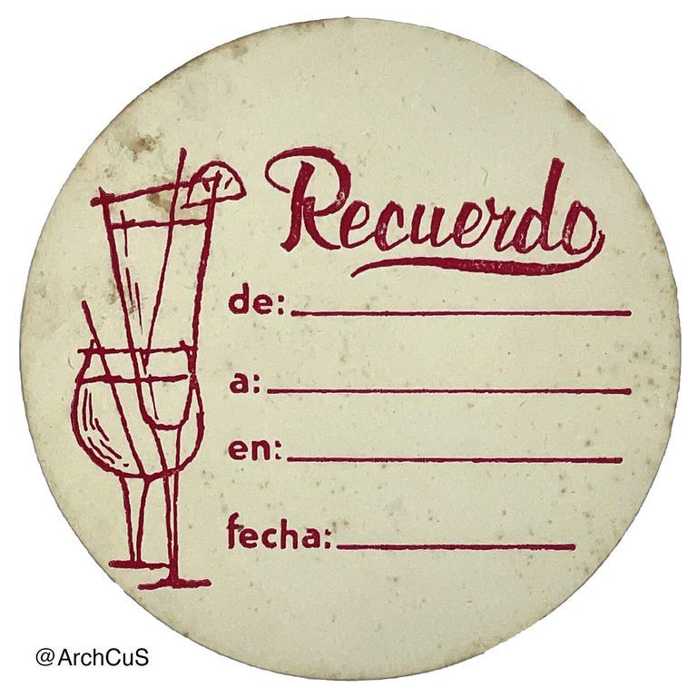 Circular Coaster with red printed design reading "Recuerdo" and several prompts to fill. A small drawing of two cocktail glasses is on the left side.