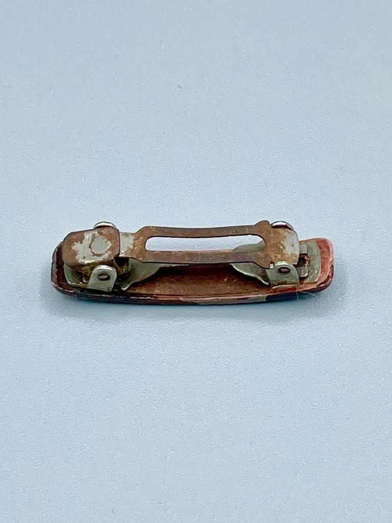 Hair barrette with dark plastic cover and metal spring clasp - Image 2