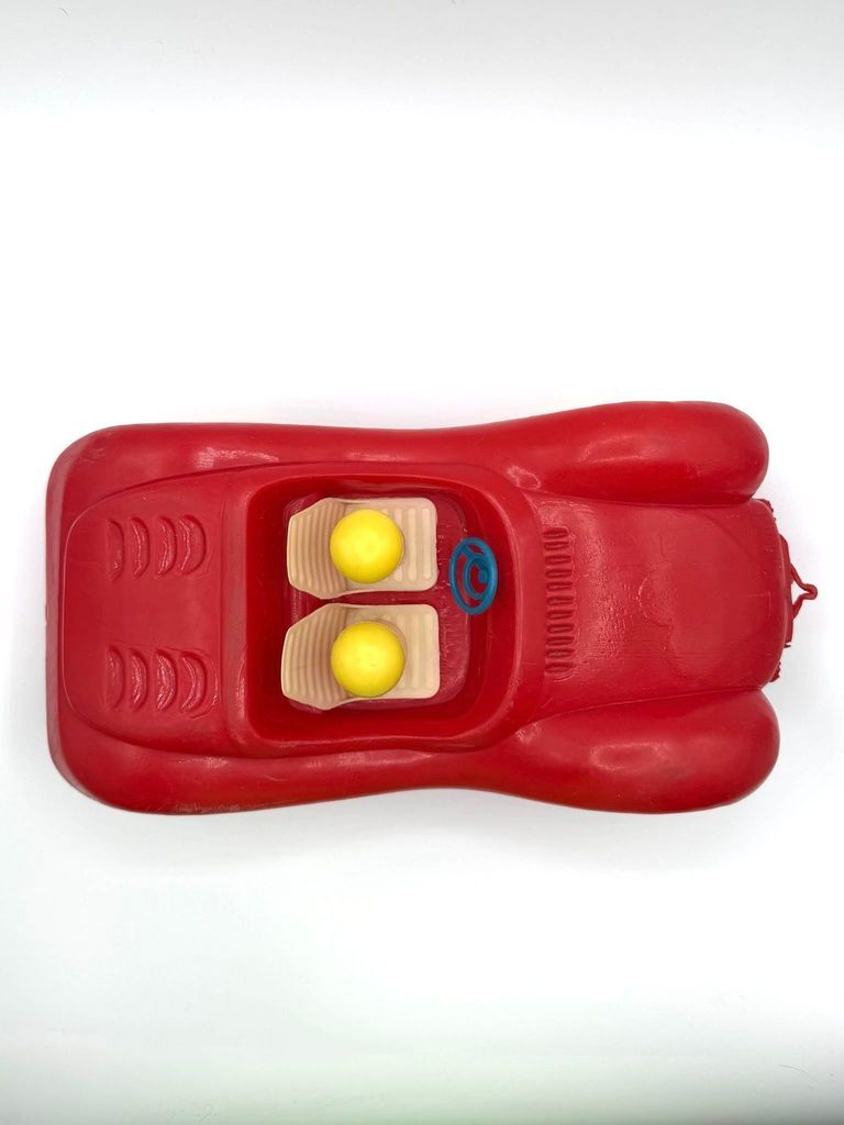 Child's plastic toy car with two peg figures