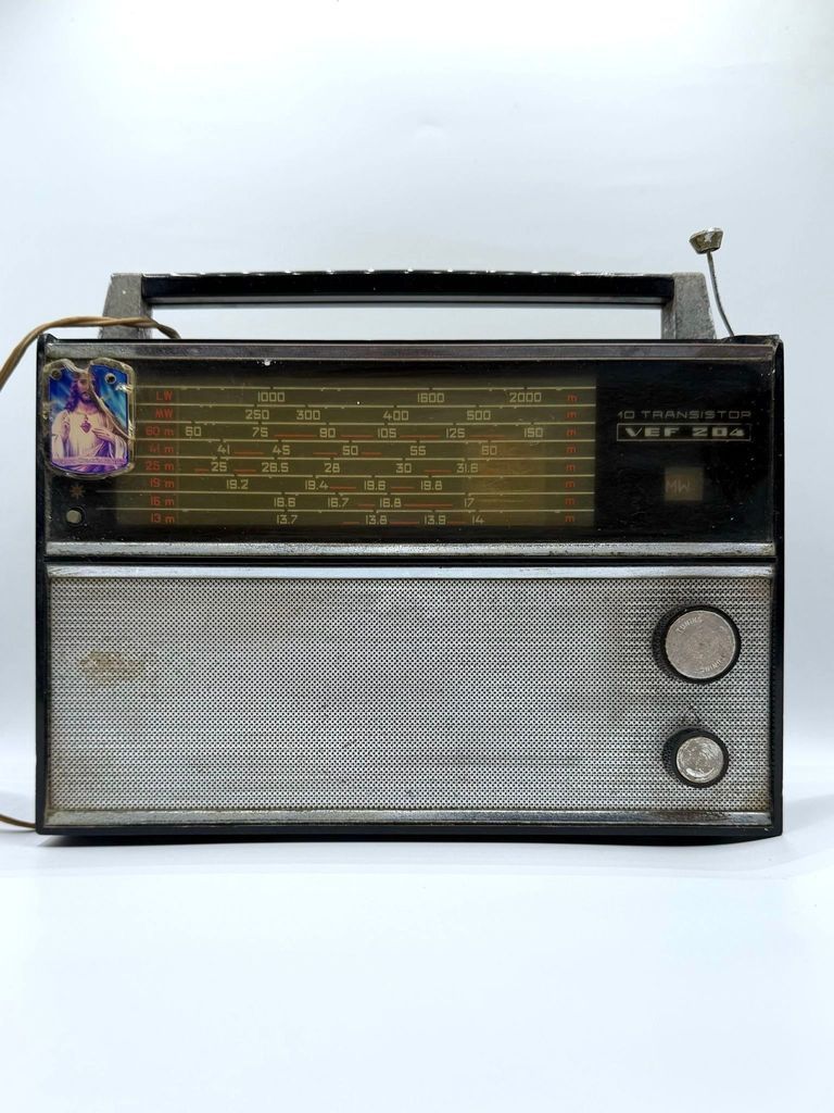 VEF 204 transistor radio, with affixed Sacred Heart of Jesus devotional image