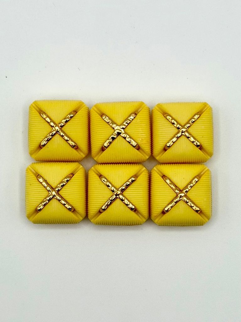 Set of six matching square buttons, yellow with golden "X" motif