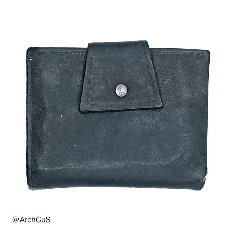 Black leather bifold wallet with snap tab