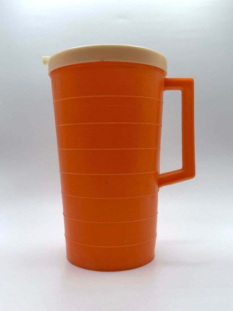Lidded plastic pitcher, ribbed (orange with ivory lid)