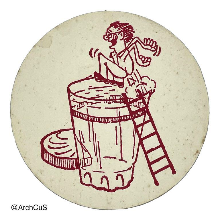 Circular coaster with design of man jumping into a glass of beer printed in maroon ink.
