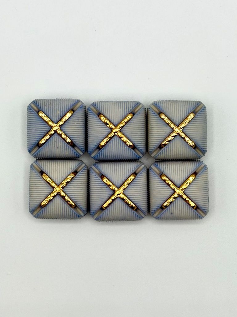 Set of six matching square buttons, blue with golden "X" motif