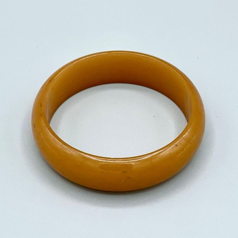 Bangle bracelet, butterscotch/amber plastic (Jablonec)
