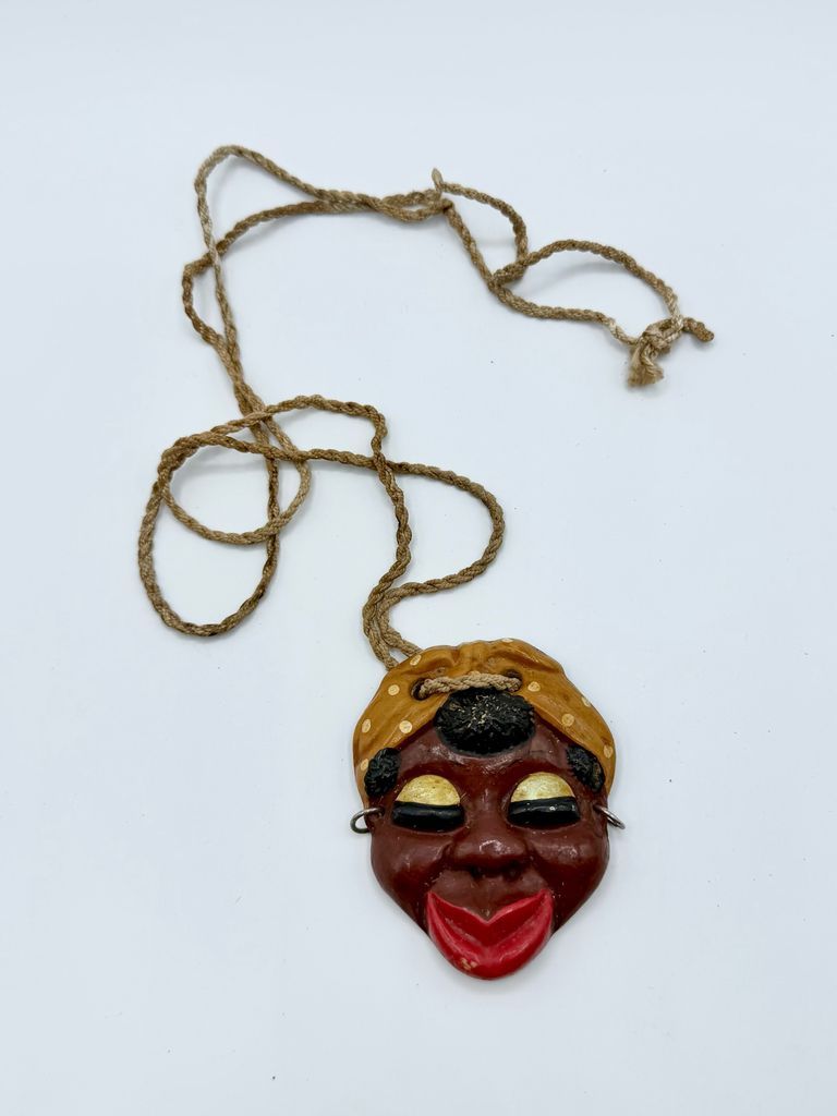 Ceramic face pendant, Afro-Cuban woman in a headscarf, on fiber cord