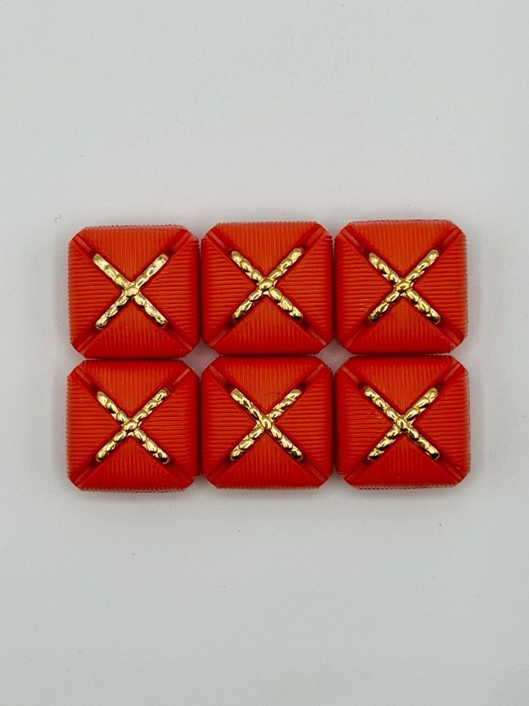 Set of six matching square buttons, red with golden "X" motif