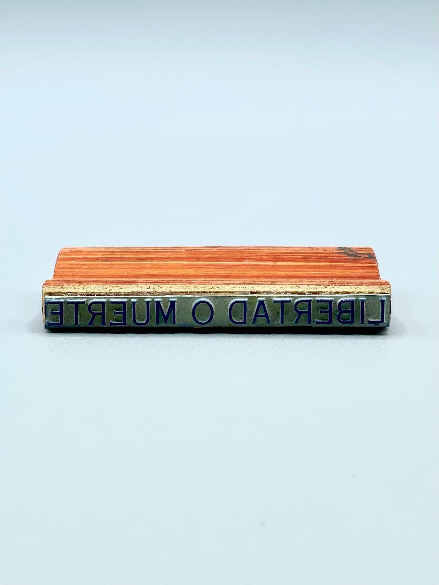          Hand rubber stamp reading 