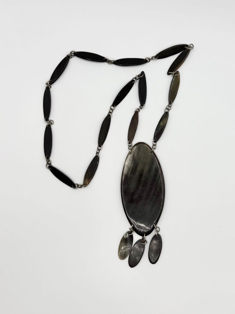 Horn necklace with linked navette plaques and oval pendant