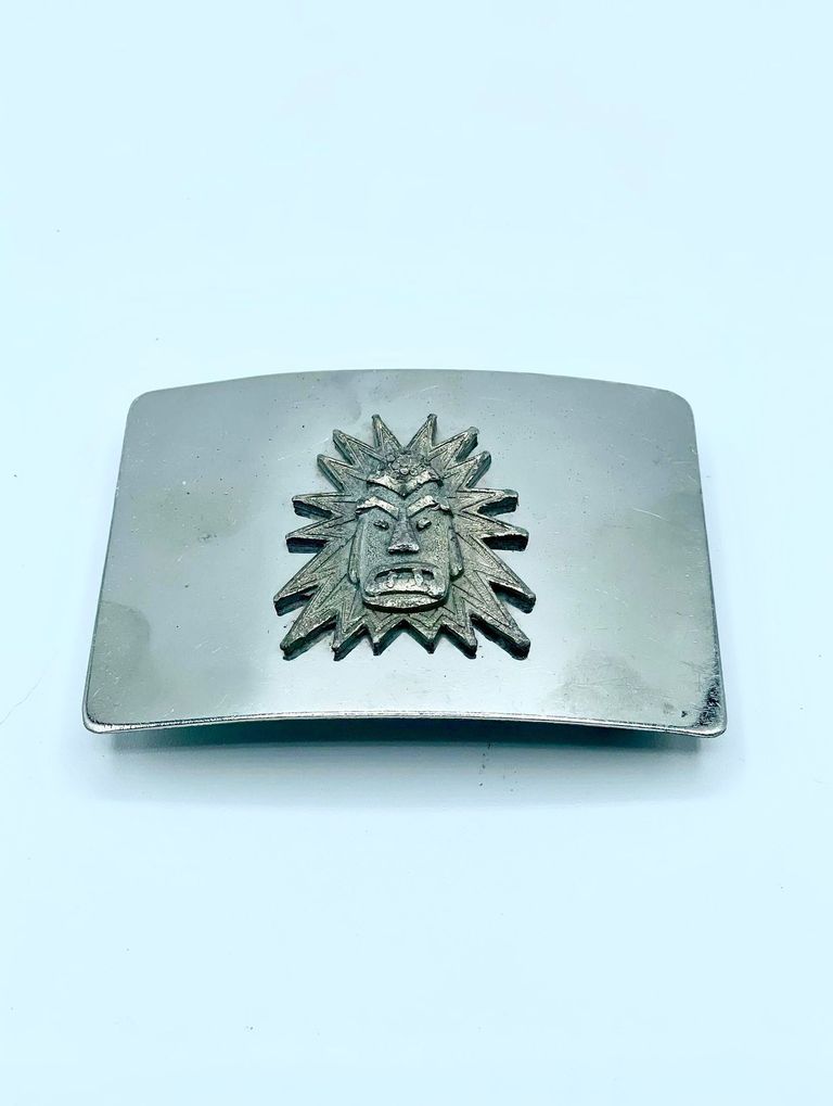 Belt buckle, artisanal, with radiant sun-face (mask) appliqué