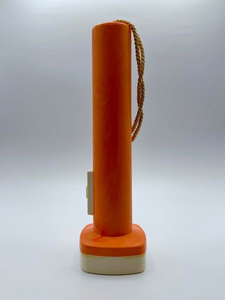 Pocket flashlight (torch) — marbled orange plastic with cream head