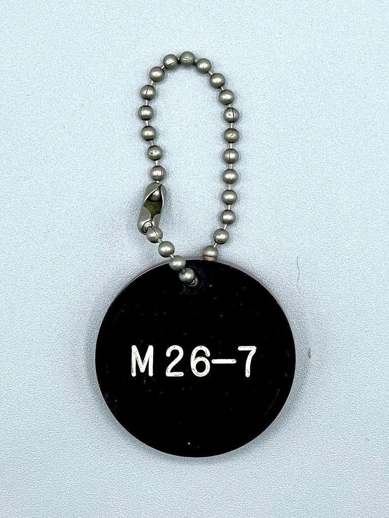 Double-sided "M 26-7" keychain fob (Movimiento 26 de Julio)