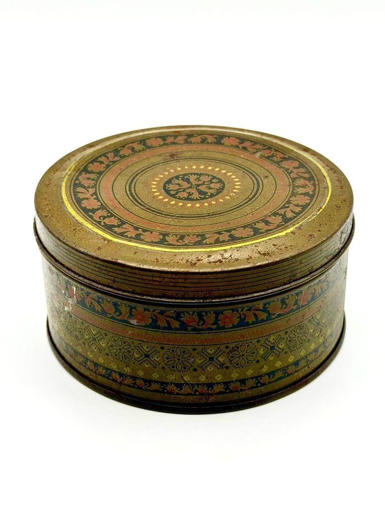 Decorative lithographed tin (round slip-lid canister)