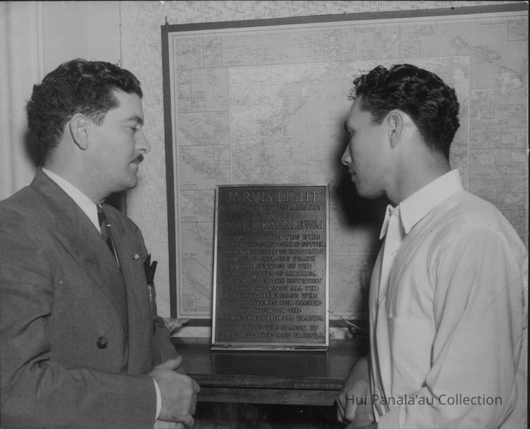 Left - Richard B. Black, representative of the U.S. Dept. of the Interior of Honolulu and Albert Akana Jr., leader of a group of Hawaiian boys who are stationed on Jarvis island to maintain the weather observation station for their country. picture number 1