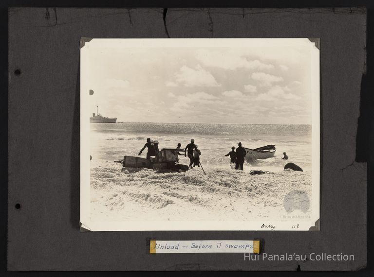 Men bringing supplies ashore unknown island picture number 1