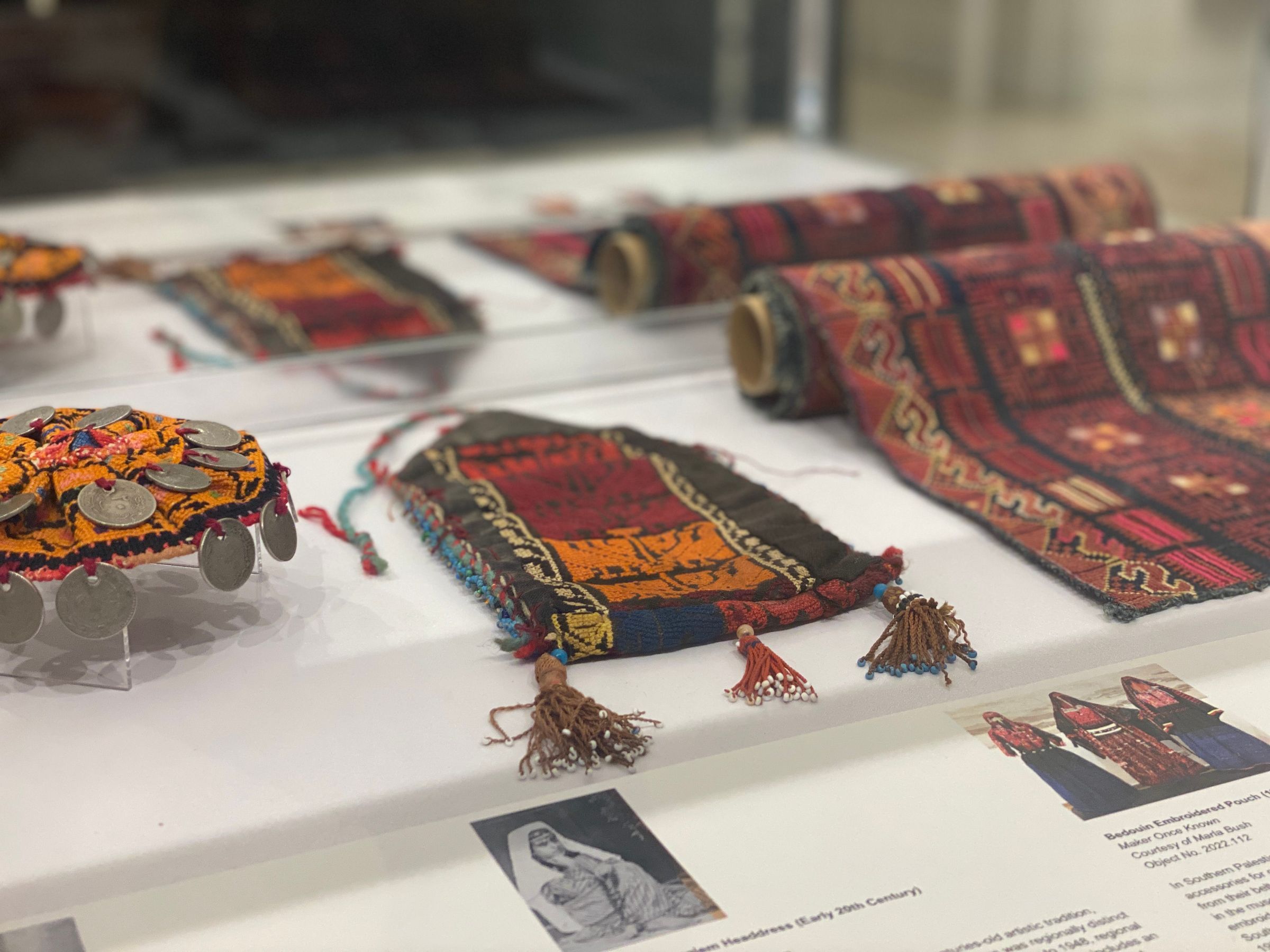 This object is featured on the right, rolled on an archival tube.