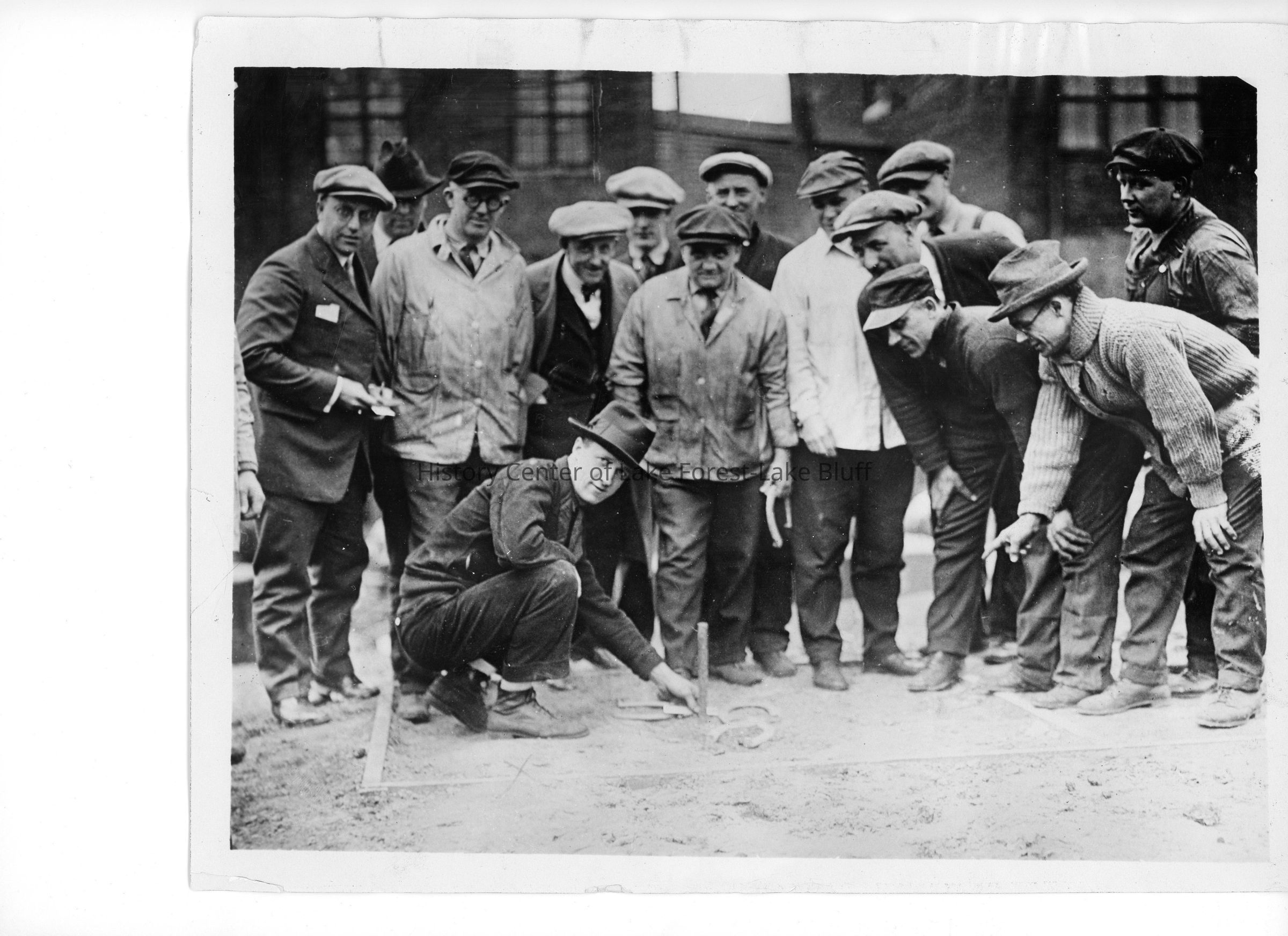 "Harold Fowler McCormick Jr. is seen here with Harvester employees. His parents, Harold Sr. and Edith (Rockefeller) McCormick built an estate they called Villa Turicum which covered 300 acres in far south east Lake Forest. Walden was built for Cyrus McCormick II on 80 lakefront acres just to the north. Cyrus McCormick III lived nearby in a house called Argyllshire, named after a region of Scotland."