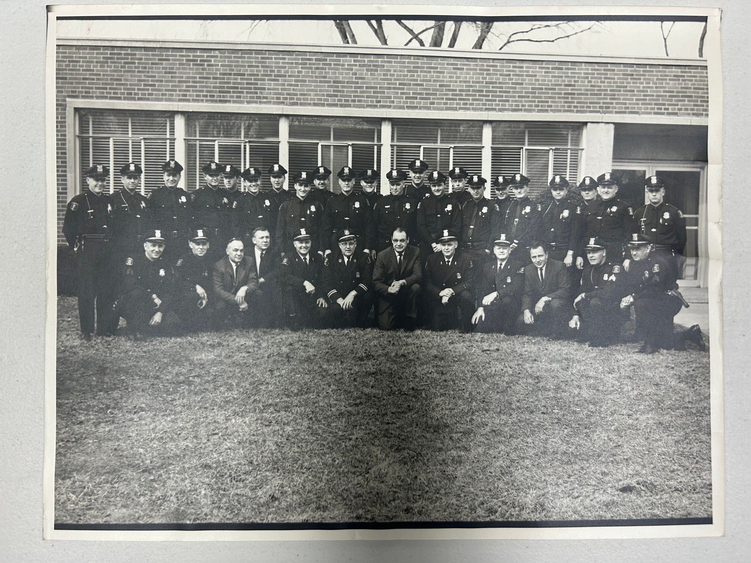 Left to right standing: Gwen Williams Whitworth Jr.(Patrolman), Ralph Corwell(Patrolman), Donald Kendrick(Patrolman), William Joseph Biggerstaff(Patrolman), William Carol Davidson(Patrolman), Micheal Ralph Butler(Patrolman), Fredrick Lee Staffrord(Patrolman), Ronald Charles Kea(Patrolman), Edwin John Grajek(Patrolman), Willard Clay Peterson(Patrolman), John Thomas Wright(Patrolman), James Junior Staley(Patrolman), Richard Joseph Kwapich(Patrolman), Cylde Anthony Areeda(Patrolman), William Walter Bartels(Patrolman), Arthur Wayne Morton(Patrolman). Kenneth Geogre Beasley(Patrolman), Lee Wayne Ballou, Sherman August Pruden(Patrolman), Jerry E. Warden(Patrolman), Heli Johannes Malkowski(Patrolmaln), Kenneth Lynn Kissel(Patrolman). Kneeling Row: Stanley Sak(Sergeant), Robert Eugene Trower(Sergeant), Walter Douglas MaGreagor(Det Lt), Burl dean Smith(Det Lt), Harold Nortman Meldrum(Lieutenant), Richard V. McWilliams (Captain), Edward A. Yester(Chief), Edward Wilkerson Harris(Lieutenant), Herbert Haslam(Lieutenant), Leland Ray Lecornu(Det Sgt), Kenneth Allison Taylor(Sergeant), James Robert Almos(Sergeant).