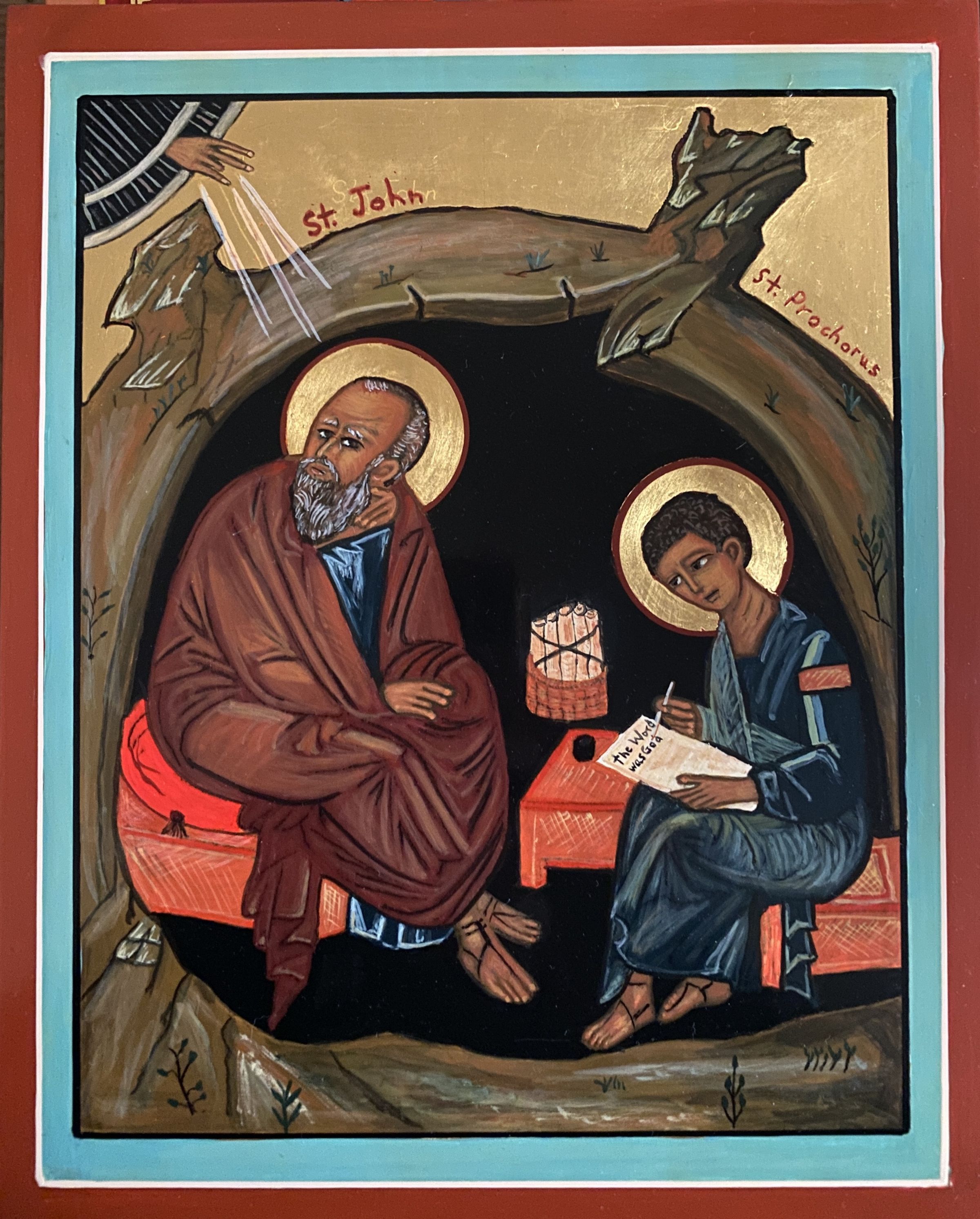 The image is a religious icon depicting two figures, each with a halo, seated inside a cave or grotto, one labeled "St. John" and the other "St. Prochorus," with St. John appearing contemplative and St. Prochorus writing on a scroll; above them, a divine hand emerges from the sky, suggesting spiritual inspiration; the setting is simple yet spiritually rich, with reds and golds, illustrating a scene from Christian tradition, possibly referring to the writing of