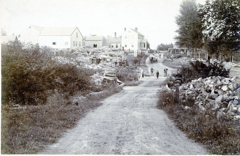          Bridge over Cathance Stream, next to Kilby and Smith's Sawmill, Marion, Maine; Lumber, boards and refuse piled next to the J.C. Allan House, later belonging into B.L. Smith, on the County Road over Cathance Stream in Marion , Maine, c. 1880.  The pile of short pieces to the right were saved for making shingles at the mill on the downstream side of the bridge.
   